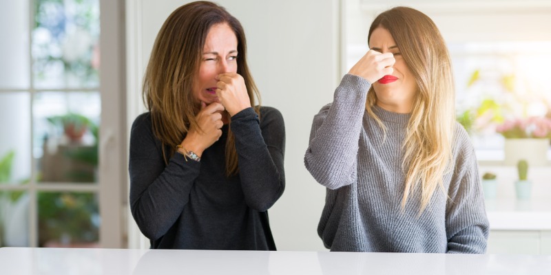 daughter and mother smelling foul odor in home